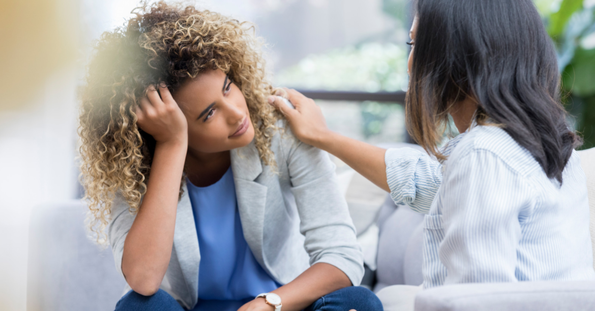 upset woman being consoled