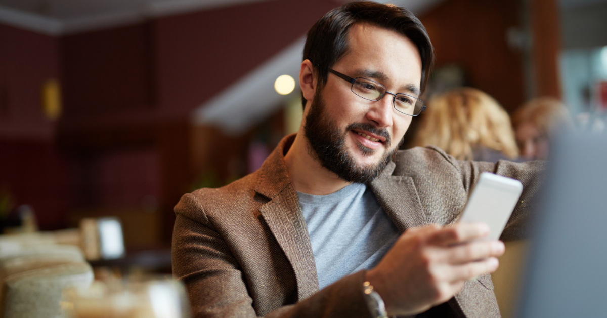 man looking at phone