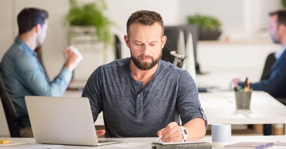 banner man working at desk